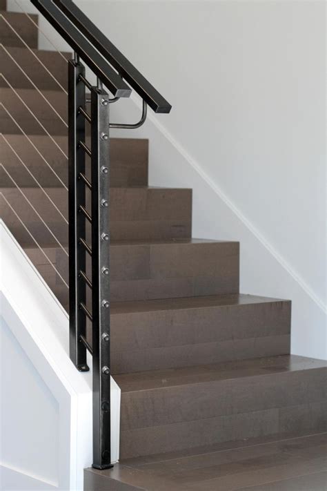 Sleek Modern Staircase With Steel Cable Railing And Black Handrails Hgtv