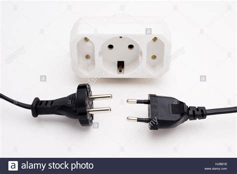 Two Different Types Of European Plugs — Type F 48mm Pins On Left