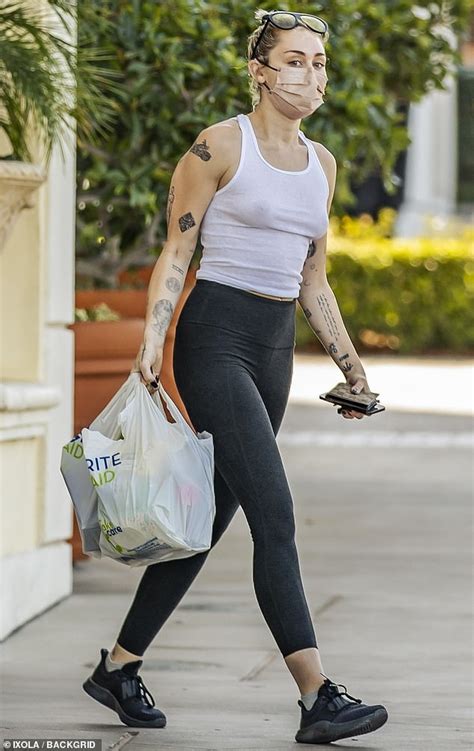 Miley Cyrus Embraces Casual Chic In A White Tank Top During A Calabasas Drugstore Excursion