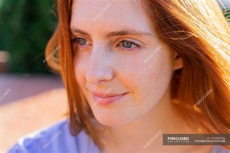 Portrait Of Redheaded Woman Looking Sideways Beautiful Hair Stock