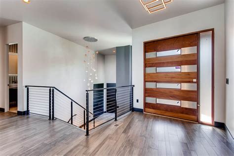 Contemporary Entry Vestibule With Cedar Door Dark Baseboards Metal