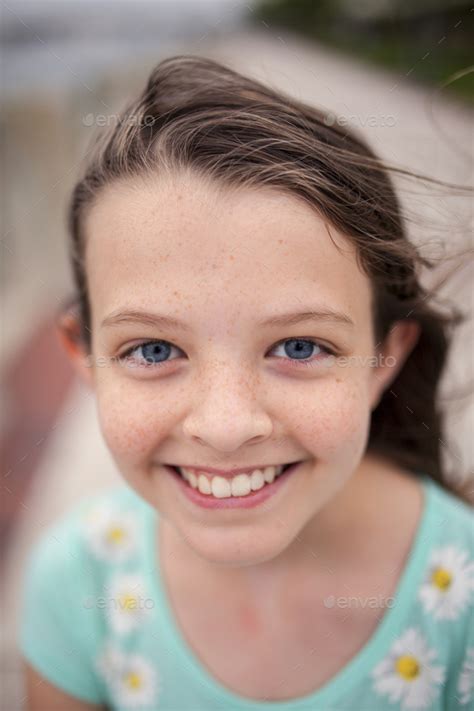 Beautiful Little Girl With Blue Eyes And Freckles Stock Photo By Wollwerth