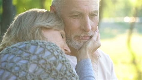 Caring Woman In Her 50s Tenderly Touching Husband Face Relationship