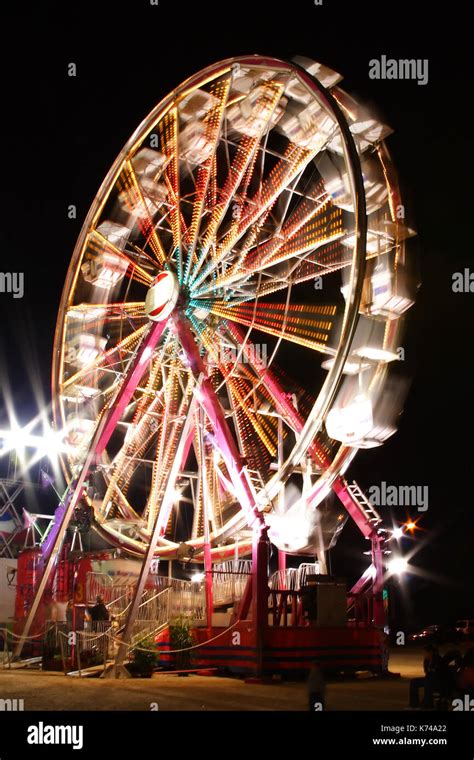 Carnival Ferris Wheel In Motion At Night Stock Photo Alamy