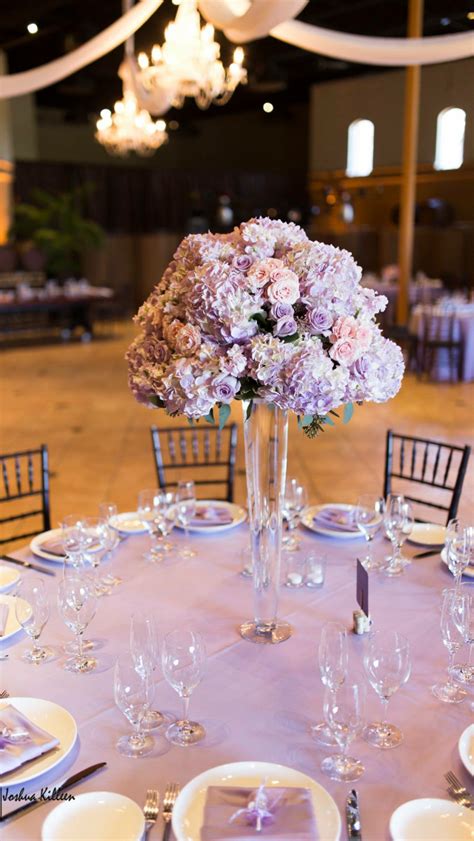 Bohemian wedding inspiration in romantic shades of purple. Tall wedding centerpiece in lavender and blush pink | Lavender wedding decorations, Tall wedding ...