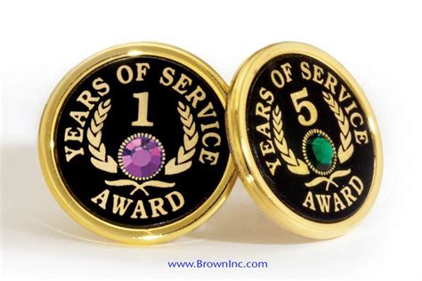 Two Black And Gold Colored Coins With The Words 1 Year Of Service Award