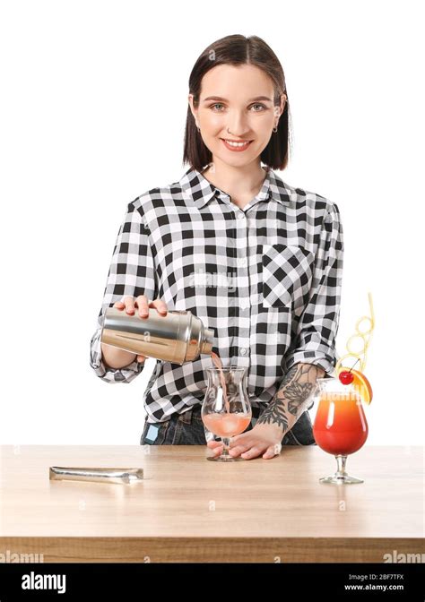 Beautiful Female Bartender At Table Against White Background Stock