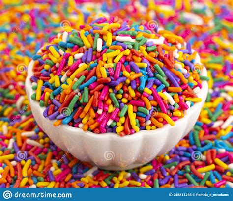A Bowl Of Rainbow Sprinkles On A Table Of Sprinkles Stock Image Image