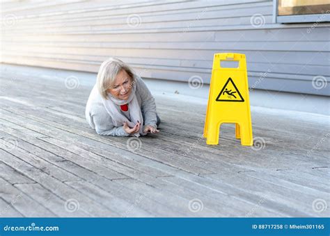 Senior Lady Slipping And Falling On A Wet Surface Stock Photo Image