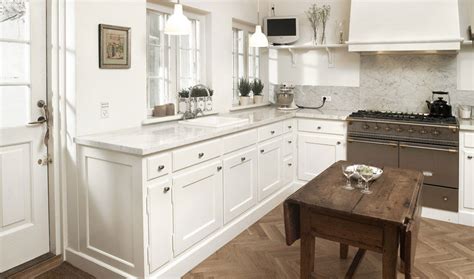 In the kitchen in mary jo bochner's savannah, georgia, kitchen , a sony tv is tucked into a niche above the refrigerator. Beautiful White Kitchen with LCD TV - Interior Design Ideas