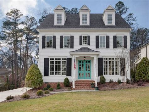 Changing your front door colour is an easy project with a dramatic impact on your curb appeal. DJF Builders | Lot 75 Bellevue Terrace | Custom home builders, Traditional exterior, House exterior