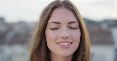 Close Up Portrait Of Beautiful Young Woman Smiling Hair Blowing In