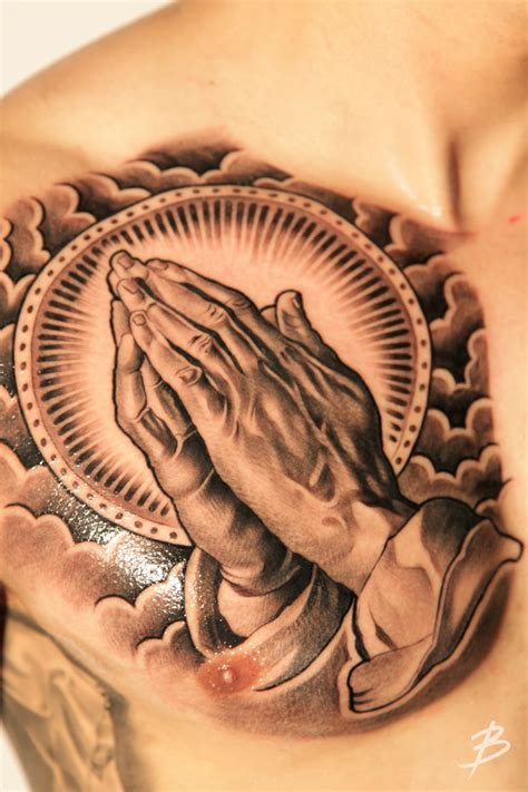 The cross mark in the pray hand tattoo depicts to the lord jesus. PRAYING HANDS. - Tattoo Day's