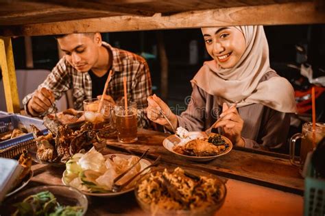 Muslim Couple Enjoy Having Iftar Dinner At Traditional Food Stall Stock Image Image Of