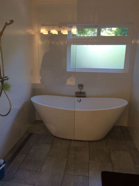 Everything inside the shower enclosure is waterproof. Interesting - modern bath tub inside the shower enclosure ...