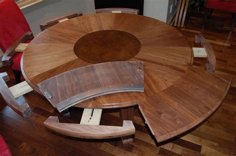 George johnson of johnson furniture, who specializes in expanding circular dining tables, demonstrates how this style of table doubles in size just by turning it on its base.the particular one used in the demonstration is made of walnut curl and was the first expanding table he'd ever made. Expanding Round Table : Expandable Round Dining Table ...