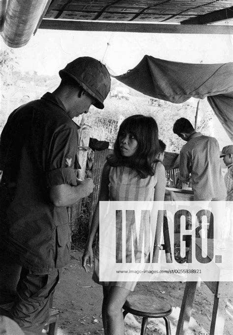 vietnam war us soldier talks with vietnamese prostitute at a car wash in which the girls would