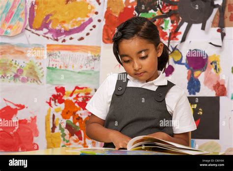 A Young School Girl Reading Stock Photo Alamy