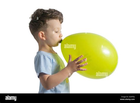 Funny Boy Blowing Up A Yellow Balloon Isolated On White Background