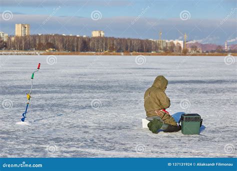 Man Ice Fishing On A Frozen Lake Editorial Stock Image Image Of