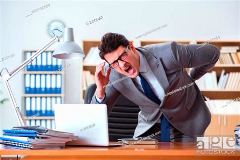 Businessman Feeling Pain In The Office Stock Photo Picture And