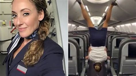 Video Flight Attendant Flips Upside Down To Close Overhead Lockers