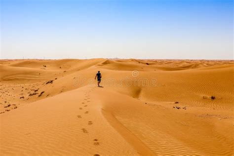 Man Walking Through The Desert Stock Photo Image Of Nature Blue