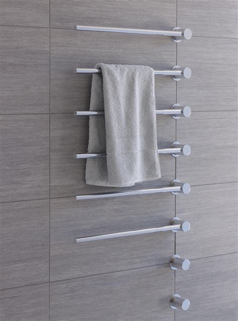 A Towel Rack With Three Towels Hanging On It S Sides And Two Metal Bars