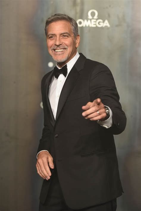 I wanted to warn you that a scammer is operating on this page: George Clooney looks sharp at OMEGA anniversary event