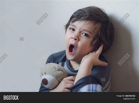 Emotional Kid Yawning Image And Photo Free Trial Bigstock