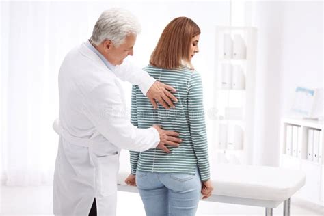 Chiropractor Examining Patient With Back Pain Stock Photo Image Of