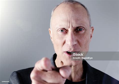 Frowning Senior Man Angrily Pointing Accusingly Stock Photo Download