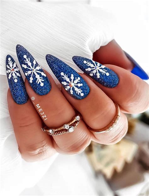 25 Pretty Holiday Nail Art Designs 2021 Snowflake On Shimmery Blue