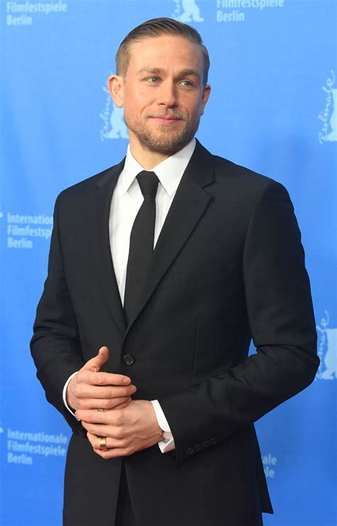 charlie hunnam is sexier than ever in a black suit at lost city of z berlin premire