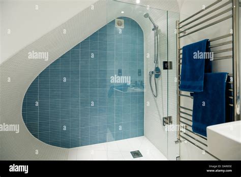 Under Stairs Basement Shower Tiled With Clean Lines Glass Shower