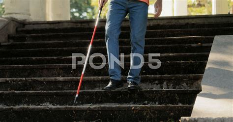 Blind Man Walking And Descending Steps In City Park Stock Footage Ad