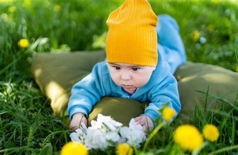 Premium Photo Young Little Child On A Summer Grass Portrait Of Joyful