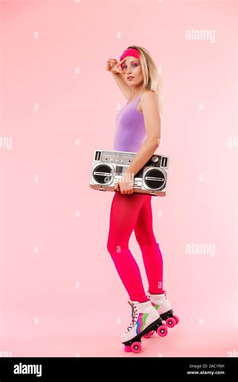 Full Length Portrait Of A Cheerful Young Blonde Girl Wearing Retro