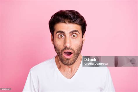 close up photo of shocked astonished middle eastern man hear incredible news feel stupor