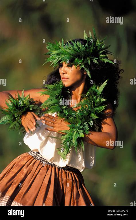 Hawaii Outdoor Front Angle Of Woman Dancing Hula Wearing Fern Haku Lei And Kupee Blurry