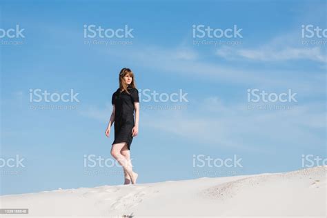 Young Woman In Black Dress Walk In Sand Dunes Stock Photo Download
