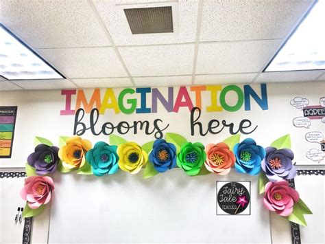 An Office Decorated With Colorful Paper Flowers And Congratulations