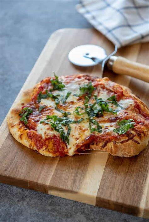 On frozen pizzas, the labels spell it out: Air Fryer Margherita Pizza - Garnished Plate