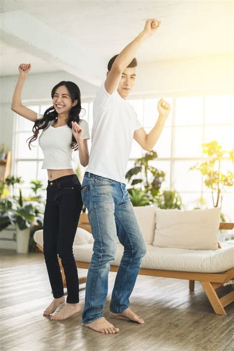 Happy Young Couple Dancing In Living Room At Home Stock Image Image
