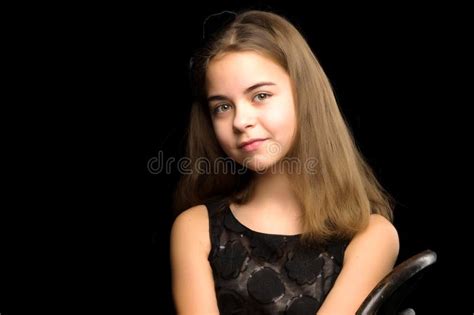 Close Upportrait Of A Cute Little Girl On A Black Background Stock