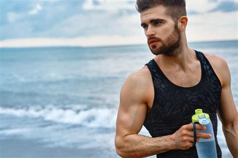 Hot Thirsty Man Drinking Water Drink After Running Outdoors Sport