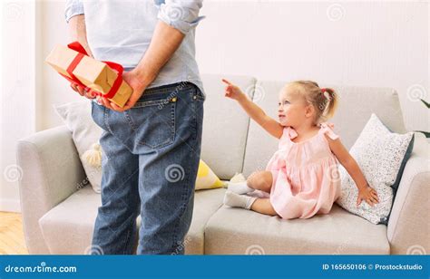 Daddy Hiding Present For Daughter Behind His Back Stock Photo Image