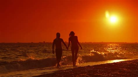 Couple Walking Along Summer Beach At Sunset Stock Footage Video 2526950 Shutterstock