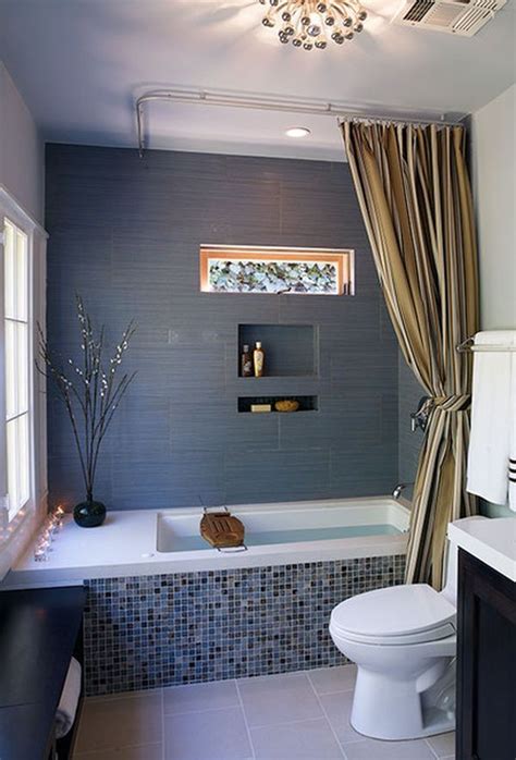 He worked around the retro tiled wall, choosing a blue color palette. 40 grey mosaic bathroom wall tiles ideas and pictures