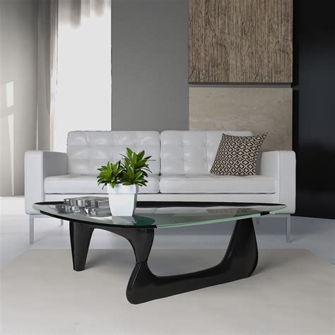 Our favorite glass coffee tables to enhance a living room. Isamu Noguchi Coffee Table - Glass with Black Wood Base